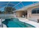 Inviting screened-in pool and spa area for relaxing and entertaining at 11458 30Th E Cv, Parrish, FL 34219