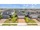 Aerial view of homes with well-manicured lawns, landscaping, and driveways in a desirable neighborhood setting at 11571 Little River Way, Parrish, FL 34219
