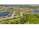 Drone view featuring the property’s location within a vibrant community near ponds and natural landscapes at 11571 Little River Way, Parrish, FL 34219