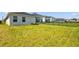 Large backyard with green lawn and secure fencing offers plenty of room for outdoor enjoyment and entertainment at 11571 Little River Way, Parrish, FL 34219