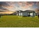 Expansive backyard with a well-kept lawn and covered patio perfect for outdoor enjoyment at 11571 Little River Way, Parrish, FL 34219