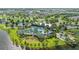 An aerial view of the community pool and the surrounding amenities, perfect for relaxation and recreation by the lake at 11571 Little River Way, Parrish, FL 34219