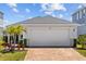 Lovely single-Gathering home with a manicured lawn and brick paver driveway at 11571 Little River Way, Parrish, FL 34219