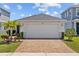 Charming single-Gathering home with a paver driveway and well-maintained landscaping at 11571 Little River Way, Parrish, FL 34219