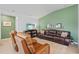Comfortable living room with modern furniture, TV, and decorative shelving at 11571 Little River Way, Parrish, FL 34219