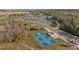 Aerial view of pickleball courts in a residential community with surrounding landscaping at 11571 Little River Way, Parrish, FL 34219