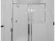 Modern bathroom shower with glass doors and tiled walls at 11571 Little River Way, Parrish, FL 34219