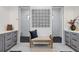 Elegant bathroom showcasing dual vanities, a seating bench, and modern design elements at 14322 Cando Ave, Port Charlotte, FL 33981