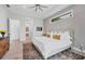 Airy bedroom featuring a modern design, accent wall, and stylish furnishings at 14322 Cando Ave, Port Charlotte, FL 33981