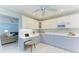 Bright kitchen featuring white cabinetry, stone countertops, and a cozy breakfast nook at 148 N Blvd Of The Presidents, Sarasota, FL 34236