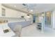 A bright kitchen with white cabinets, modern appliances and spacious countertops at 148 N Blvd Of The Presidents, Sarasota, FL 34236