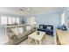 A bright living room showcases neutral tones and comfortable seating at 148 N Blvd Of The Presidents, Sarasota, FL 34236