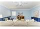 A modern living room features stylish furnishings and coastal artwork at 148 N Blvd Of The Presidents, Sarasota, FL 34236