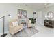 Comfortable sitting area featuring two upholstered chairs, bright windows, and tiled floors at 148 N Blvd Of The Presidents, Sarasota, FL 34236