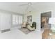 Comfortable sitting area featuring two upholstered chairs, bright windows, and tiled floors at 148 N Blvd Of The Presidents, Sarasota, FL 34236