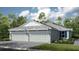 Charming single-Gathering home featuring an attached three-car garage and well-maintained landscaping at 16210 Isola Pl, Bradenton, FL 34211