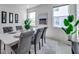 Modern dining room with contemporary decor, three windows, and a neutral color palette at 17616 Bright Wheat Dr, Lithia, FL 33547