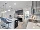 Stylish kitchen with stainless steel appliances, a large island, and a view of dining area at 17616 Bright Wheat Dr, Lithia, FL 33547