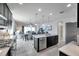 Open-concept kitchen with a large island, stainless steel appliances, and dining area at 17616 Bright Wheat Dr, Lithia, FL 33547