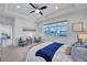 The main bedroom offers an oversized window with a lake view, carpeted floors, and sitting area at 17616 Bright Wheat Dr, Lithia, FL 33547