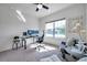 Bright office with a glass desk, ceiling fan, and two plush chairs at 17616 Bright Wheat Dr, Lithia, FL 33547