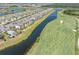 Aerial view of the condo situated on the golf course with stunning lake and pool views at 17810 Gawthrop Dr # 406, Bradenton, FL 34211