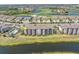 Aerial view highlighting the condo's location next to the golf course, lake, and pool at 17810 Gawthrop Dr # 406, Bradenton, FL 34211