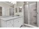 Modern bathroom features a sleek glass-enclosed shower and vanity with quartz countertop at 17810 Gawthrop Dr # 406, Bradenton, FL 34211
