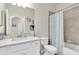 Well-lit bathroom with neutral walls. The room features a tub shower combo and plenty of storage at 17810 Gawthrop Dr # 406, Bradenton, FL 34211