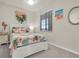Charming bedroom with tropical decor, flamingo accents, and a plush queen-sized bed at 17810 Gawthrop Dr # 406, Bradenton, FL 34211