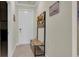 Inviting entryway featuring tile floors, a coat rack with bench, and neutral walls at 17810 Gawthrop Dr # 406, Bradenton, FL 34211