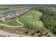Aerial view of golf course with manicured greens and residential housing at 17810 Gawthrop Dr # 406, Bradenton, FL 34211