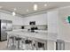 Modern, bright kitchen features stainless steel appliances, breakfast bar, and plenty of countertop space at 17810 Gawthrop Dr # 406, Bradenton, FL 34211
