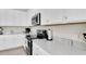 Bright kitchen with stainless steel appliances, plentiful counter space, and contemporary design at 17810 Gawthrop Dr # 406, Bradenton, FL 34211