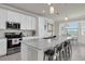 The kitchen has modern appliances, a spacious island, pendant lighting, and an eat-in dining area at 17810 Gawthrop Dr # 406, Bradenton, FL 34211