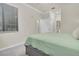 Bedroom with King Bed and entry to Ensuite Bathroom and walk-in closet at 17810 Gawthrop Dr # 406, Bradenton, FL 34211