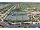 Aerial view of tennis courts with manicured landscaping and parking lot at 17810 Gawthrop Dr # 406, Bradenton, FL 34211