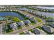 Aerial view of homes along a lakefront street highlighting the community's layout and manicured lawns at 17827 Cherished Loop, Lakewood Ranch, FL 34211