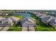An aerial view of a well-planned community surrounding a picturesque lake at 17827 Cherished Loop, Lakewood Ranch, FL 34211