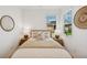 Tastefully decorated bedroom with light, relaxing decor and a lovely view from the window at 17827 Cherished Loop, Lakewood Ranch, FL 34211