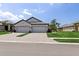 Beautiful home exterior with a spacious paved driveway and manicured lawn at 17827 Cherished Loop, Lakewood Ranch, FL 34211