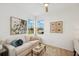 Cozy living room bathed in natural light, offering tranquil views, with refined decor and neutral tones at 17827 Cherished Loop, Lakewood Ranch, FL 34211