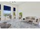 Cozy covered patio with comfortable seating and views of the pool and surrounding scenery at 17827 Cherished Loop, Lakewood Ranch, FL 34211