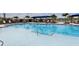 The crystal-clear swimming pool features shallow sunning areas and a chair-lined deck at 17827 Cherished Loop, Lakewood Ranch, FL 34211