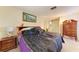 Bedroom with a full size bed, dresser, and standard window at 1809 67Th W St, Bradenton, FL 34209