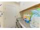Functional laundry room featuring a washer and dryer, along with storage cabinets at 1809 67Th W St, Bradenton, FL 34209