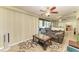 Well-lit room featuring a ceiling fan, sliding glass doors, and a comfortable sofa at 1809 67Th W St, Bradenton, FL 34209