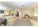 Spacious living room with plush sofas, large mirrors, and stylish decor, perfect for gatherings and relaxation at 1809 67Th W St, Bradenton, FL 34209