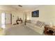 Inviting living room features neutral carpeting and an accent wall, ideal for relaxing and entertaining guests at 1809 67Th W St, Bradenton, FL 34209