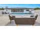 Spacious backyard featuring a pool, lounge chairs, and a cozy seating area with a well-maintained exterior at 1921 Fern Ave, Sarasota, FL 34235